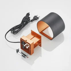 Arcchio wandlamp Zuzana, rond, zwart, stekker, 13 cm