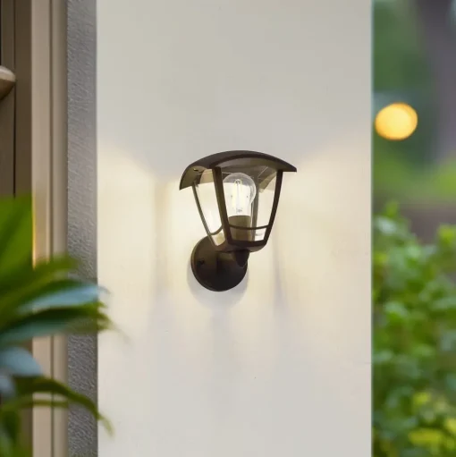 Lindby buitenwandlamp Isidoro, zwart, lantaarn, kunststof