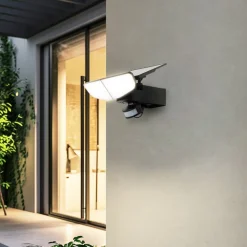 Lindby LED wandlamp op zonne-energie Naelin, zwart, sensor, IP44