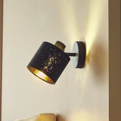 Lindby wandlamp Vasilia, Ø 12 cm, zwart/goud, stof